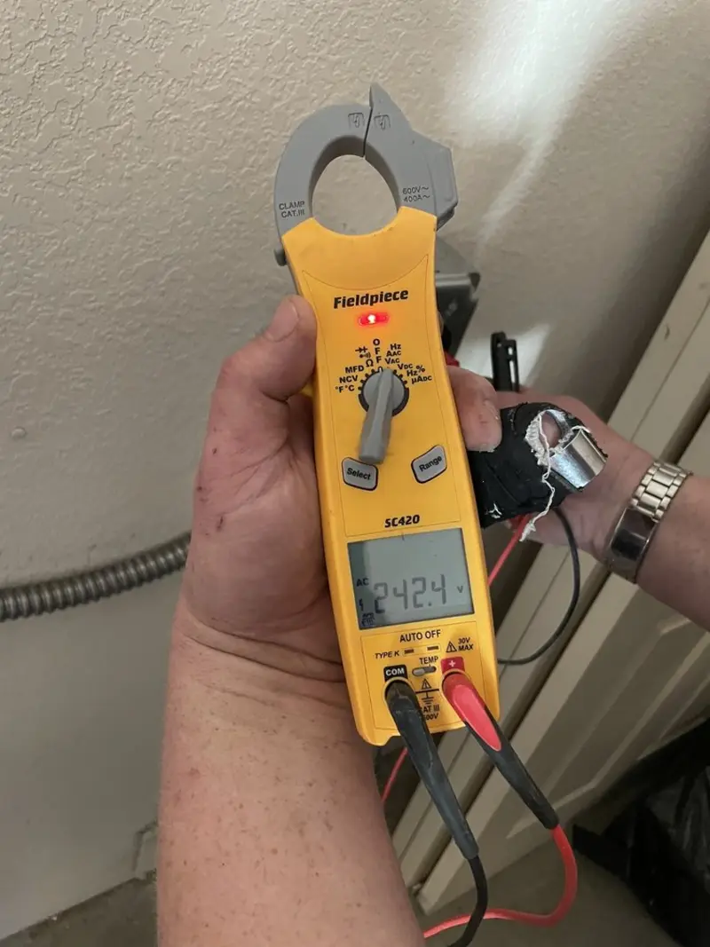 Voltage testing with clamp meter during Generator Installation in Breckenridge